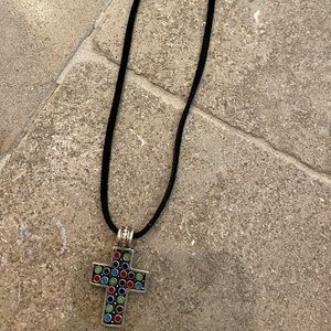 Cross on black suede rope